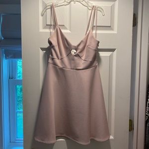 Likely light pink/lilac dress with small cut out